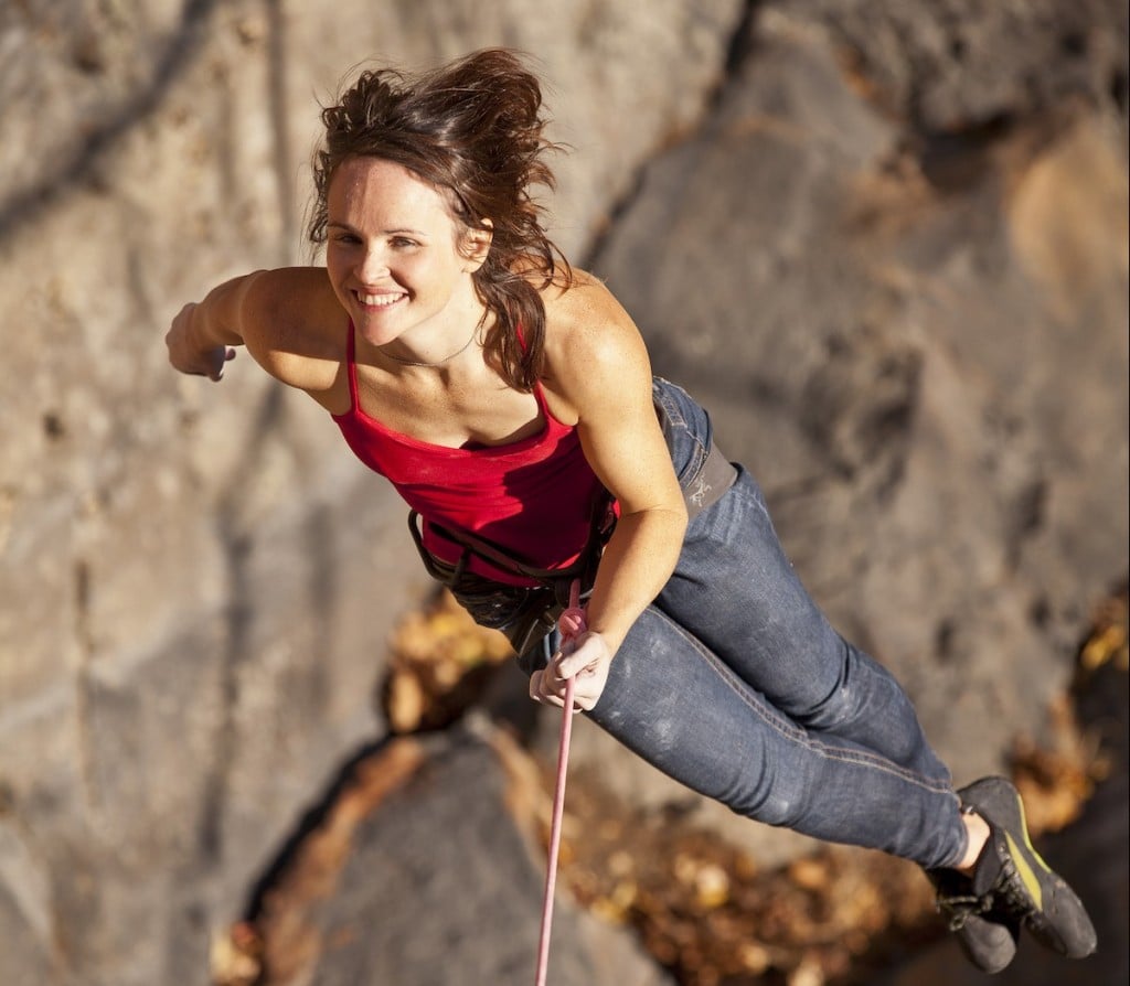 A woman is lowered off a rock climb in the New River Gorge, West Virginia.