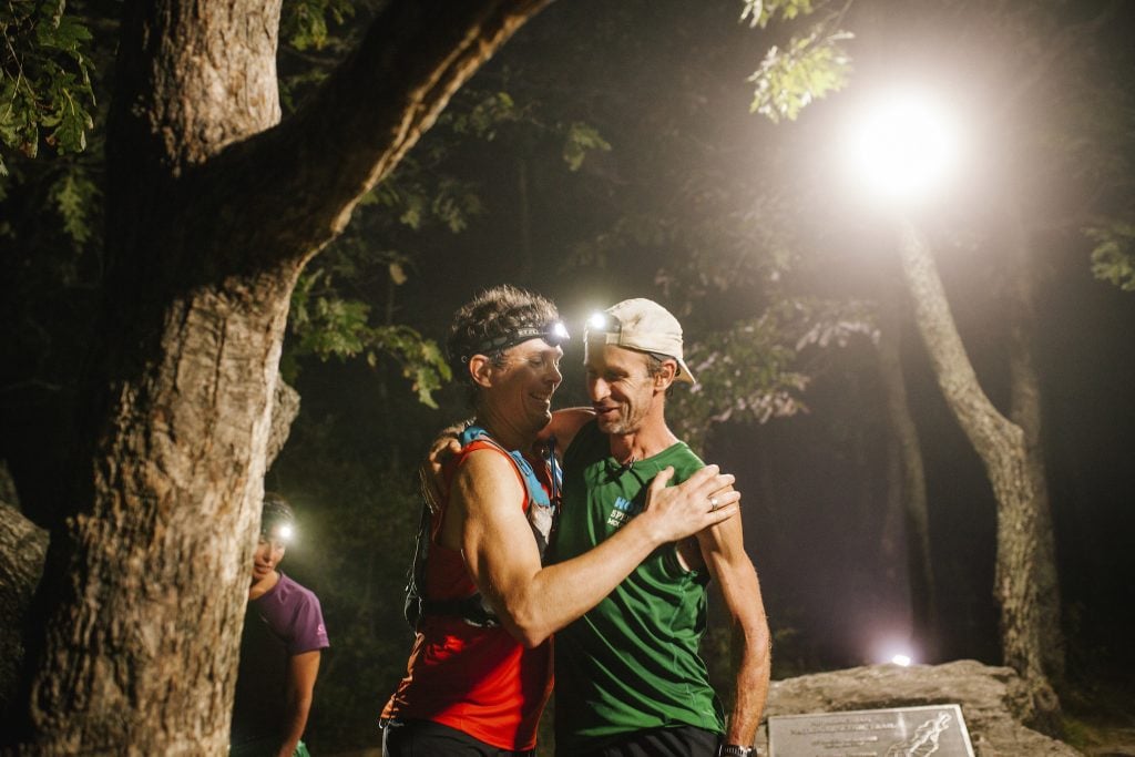 Karl Meltzer receives a hug from the previous record holder, Scott Jurek, after breaking the record for running the length of the Appalachian Trail on 18 September, 2016.